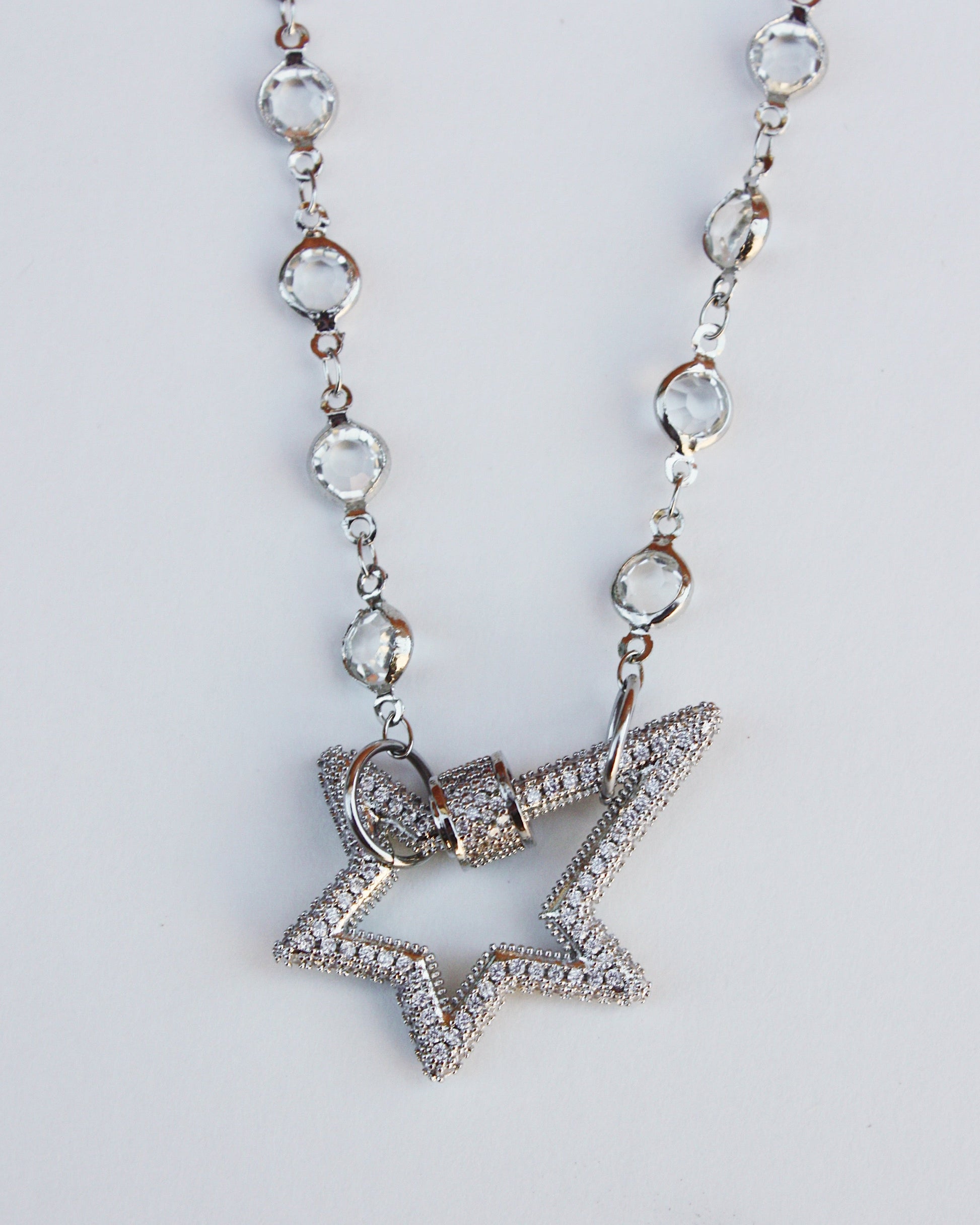 Star-shaped pendant necklace on a white background